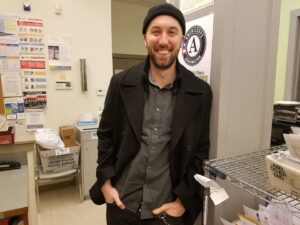 Man in hat in office